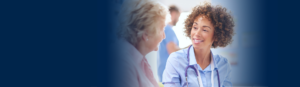 Ethnic female provider smile towards patient to the left